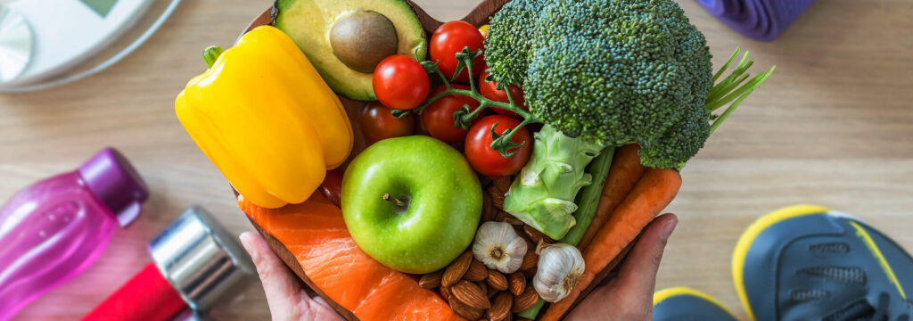 Some nice healthy foods on a plate with some weights and runners on the floor