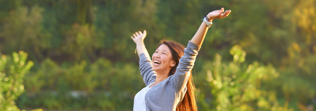 A woman cheering in winning a contest